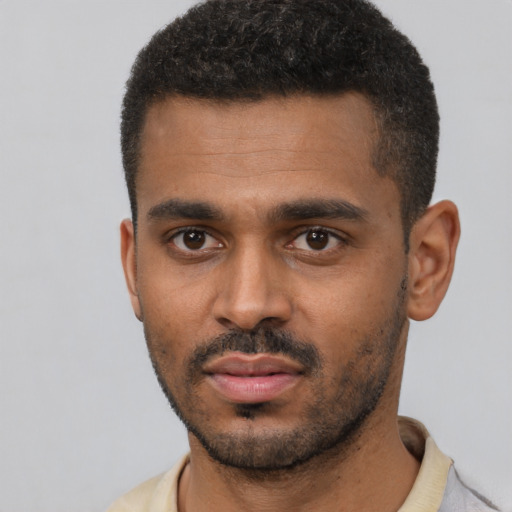 Neutral black young-adult male with short  black hair and brown eyes