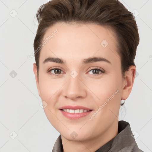 Joyful white young-adult female with short  brown hair and brown eyes