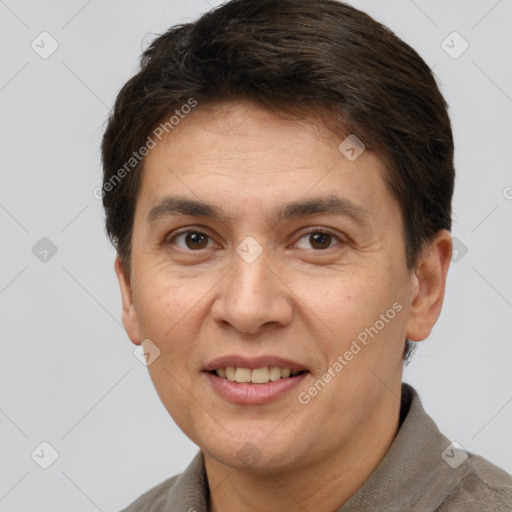 Joyful white adult male with short  brown hair and brown eyes