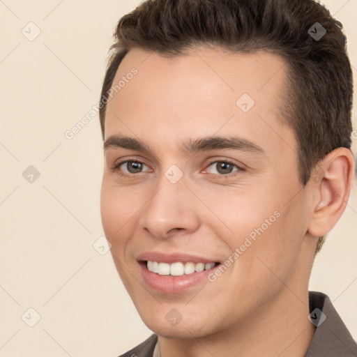 Joyful white young-adult male with short  brown hair and brown eyes