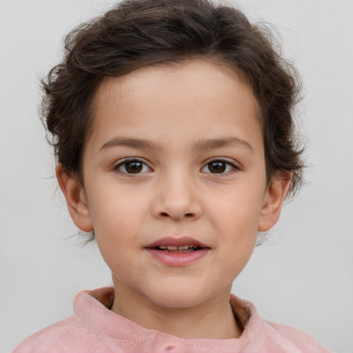 Joyful white child female with short  brown hair and brown eyes