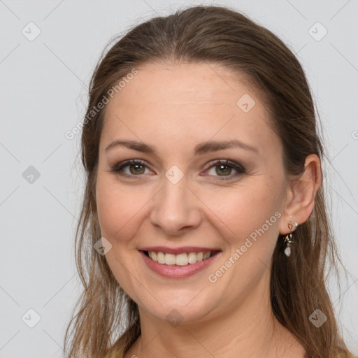 Joyful white young-adult female with long  brown hair and brown eyes