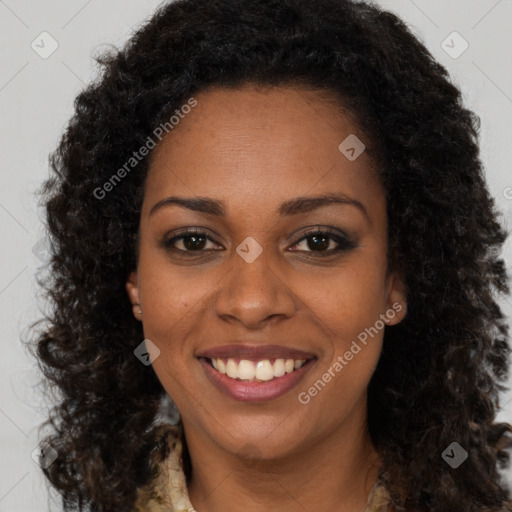 Joyful black young-adult female with long  brown hair and brown eyes