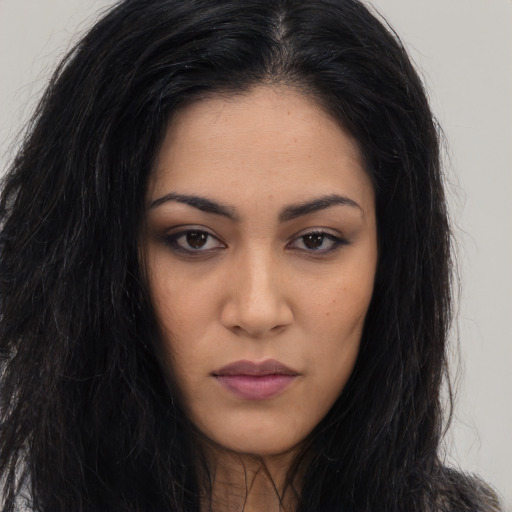 Neutral latino young-adult female with long  black hair and brown eyes