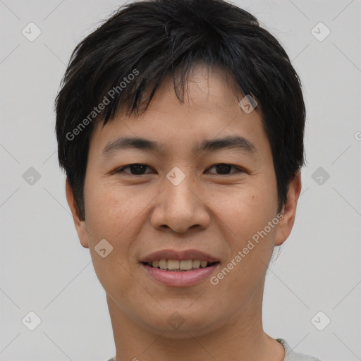 Joyful asian young-adult male with short  black hair and brown eyes