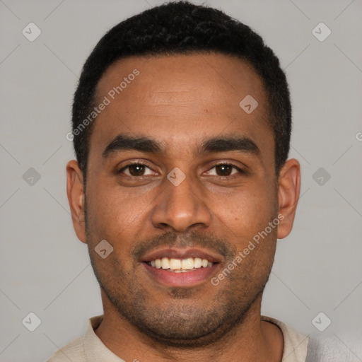 Joyful black young-adult male with short  black hair and brown eyes