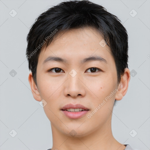 Joyful asian young-adult male with short  black hair and brown eyes