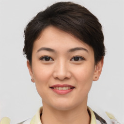 Joyful asian young-adult female with short  brown hair and brown eyes