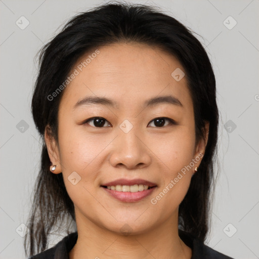 Joyful asian young-adult female with medium  brown hair and brown eyes