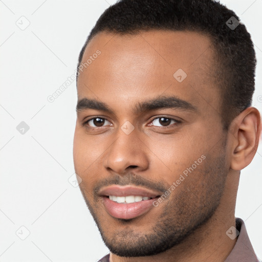 Joyful black young-adult male with short  brown hair and brown eyes