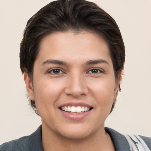 Joyful white young-adult female with short  brown hair and brown eyes