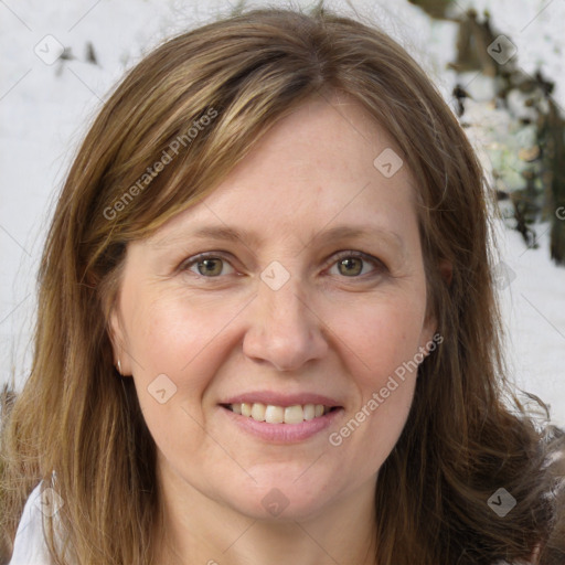 Joyful white adult female with medium  brown hair and grey eyes