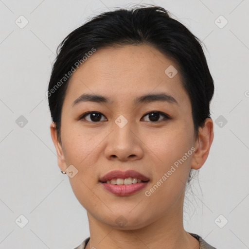 Joyful asian young-adult female with medium  black hair and brown eyes