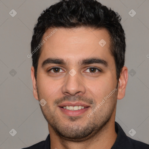 Joyful white young-adult male with short  black hair and brown eyes