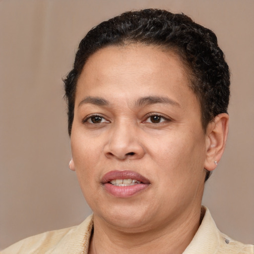 Joyful latino adult female with short  brown hair and brown eyes