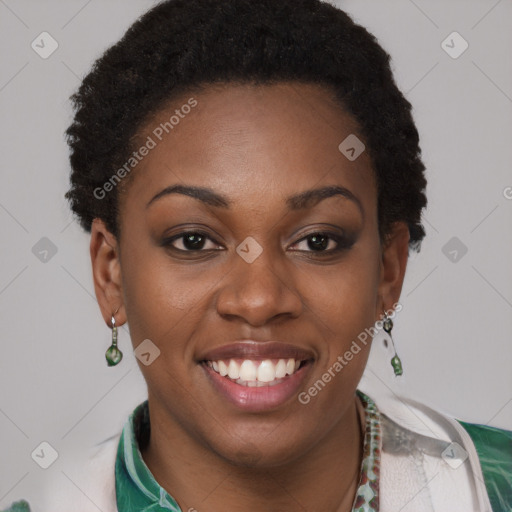 Joyful black young-adult female with short  brown hair and brown eyes