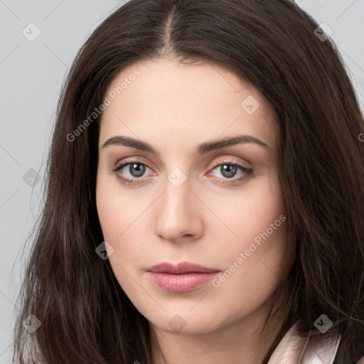 Neutral white young-adult female with long  brown hair and brown eyes