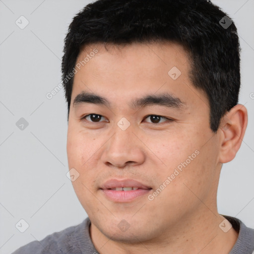 Joyful asian young-adult male with short  black hair and brown eyes