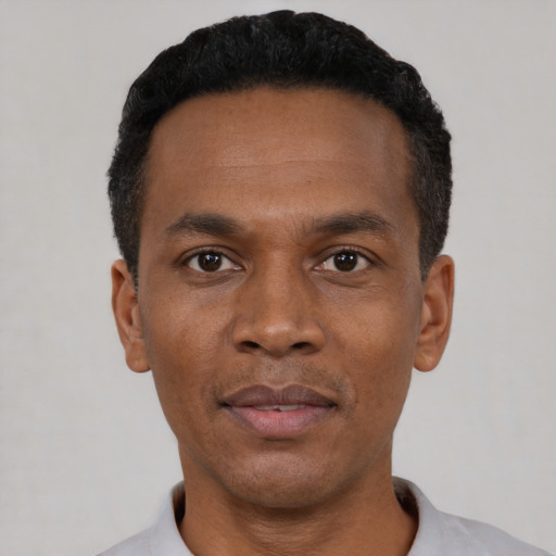 Neutral black young-adult male with short  black hair and brown eyes