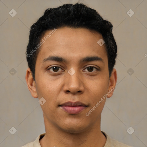 Joyful latino young-adult male with short  black hair and brown eyes