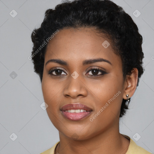 Joyful black young-adult female with short  black hair and brown eyes