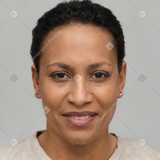 Joyful black adult female with short  brown hair and brown eyes