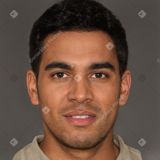 Joyful latino young-adult male with short  brown hair and brown eyes