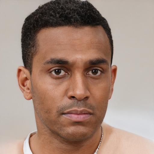 Neutral black young-adult male with short  brown hair and brown eyes