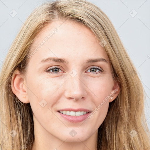 Joyful white young-adult female with long  brown hair and blue eyes