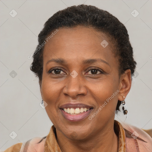 Joyful latino adult female with short  brown hair and brown eyes