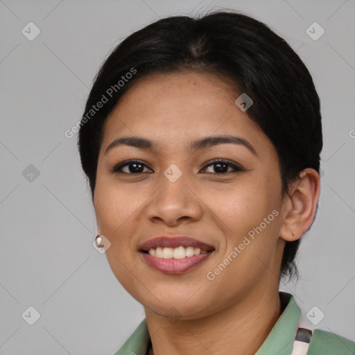 Joyful asian young-adult female with short  brown hair and brown eyes