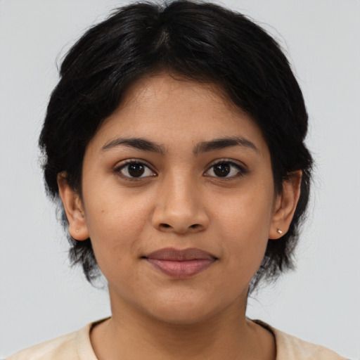 Joyful asian young-adult female with medium  black hair and brown eyes