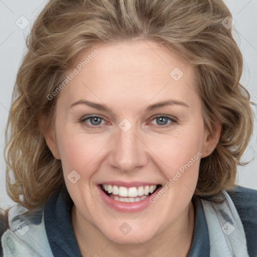 Joyful white young-adult female with medium  brown hair and blue eyes