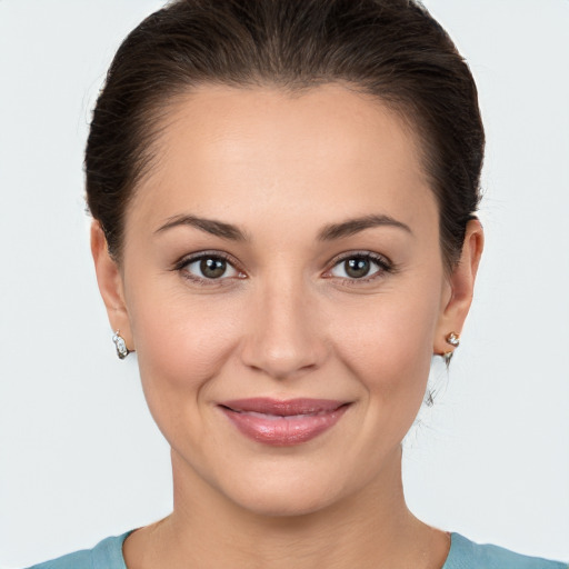 Joyful white young-adult female with medium  brown hair and brown eyes