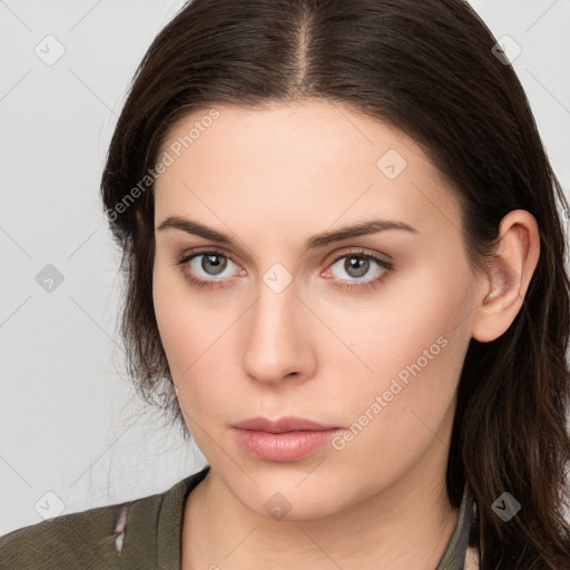 Neutral white young-adult female with long  brown hair and brown eyes