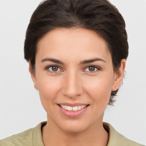 Joyful white young-adult female with medium  brown hair and brown eyes