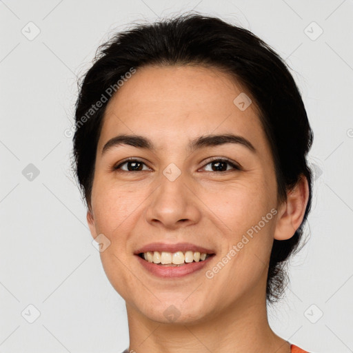 Joyful white young-adult female with short  black hair and brown eyes