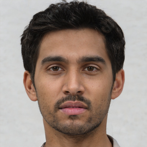 Neutral white young-adult male with short  black hair and brown eyes