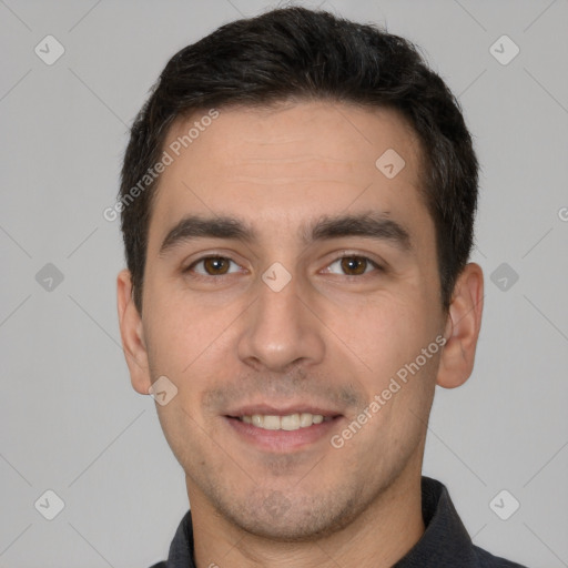 Joyful white young-adult male with short  black hair and brown eyes