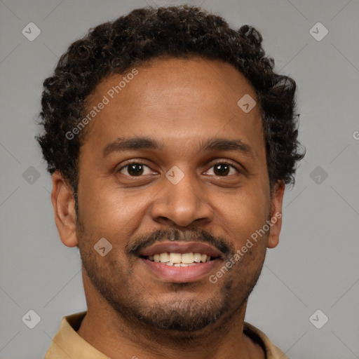 Joyful black young-adult male with short  brown hair and brown eyes