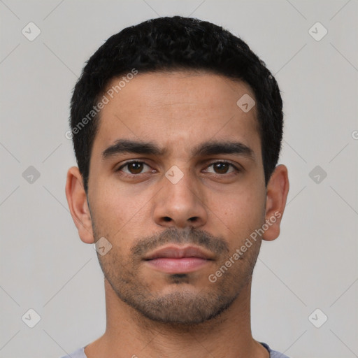 Neutral latino young-adult male with short  black hair and brown eyes