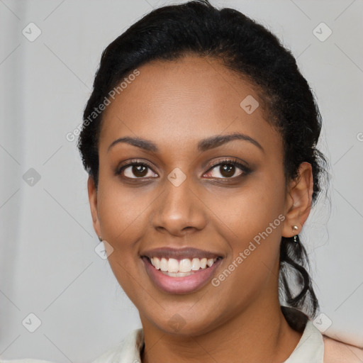 Joyful latino young-adult female with long  black hair and brown eyes