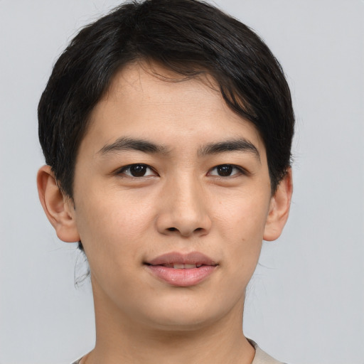 Joyful asian young-adult male with short  brown hair and brown eyes