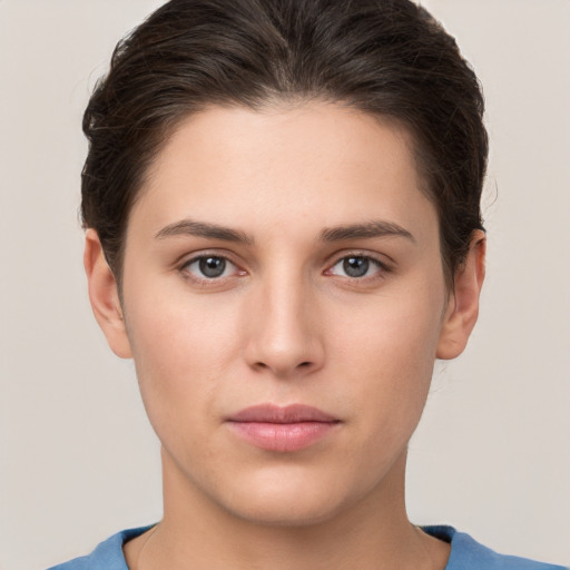 Neutral white young-adult female with short  brown hair and brown eyes