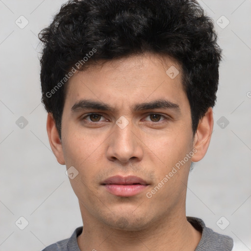 Neutral white young-adult male with short  black hair and brown eyes