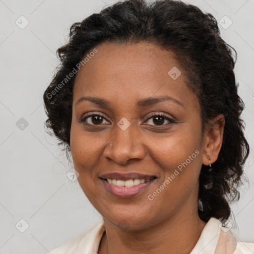 Joyful latino adult female with medium  brown hair and brown eyes