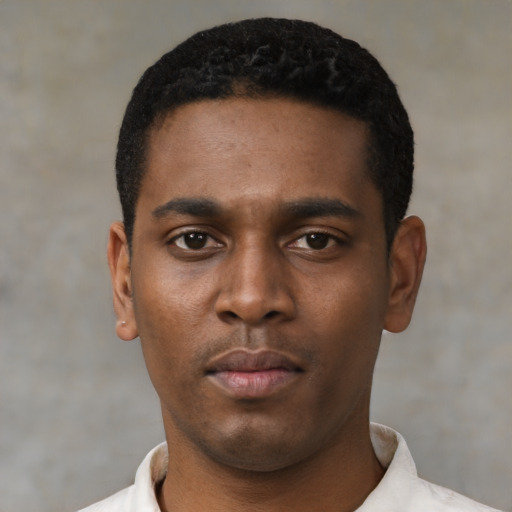 Neutral black young-adult male with short  black hair and brown eyes