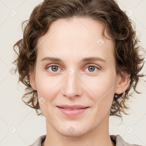 Joyful white young-adult female with medium  brown hair and green eyes