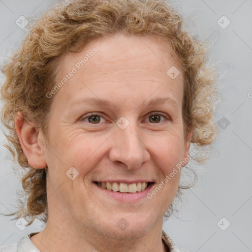 Joyful white adult female with medium  brown hair and blue eyes