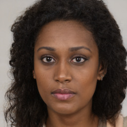 Neutral black young-adult female with long  brown hair and brown eyes